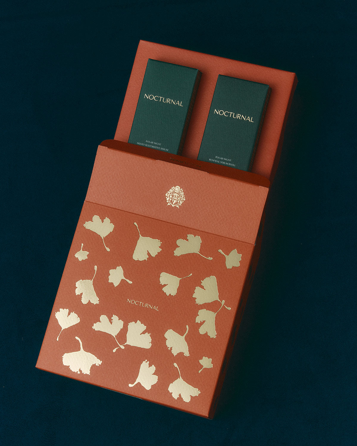 Red box with 'Nocturnal' branding and leaf design on a dark background