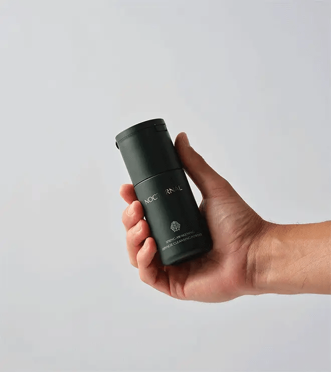 Hand pouring Spring Awakening Japanese Enzyme Cleansing Powder from the bottle